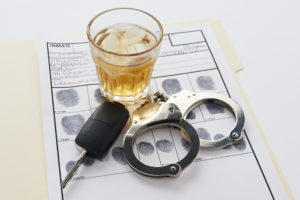 handcuffs, keys, and alcohol