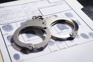 handcuffs and fingerprints DUI concept